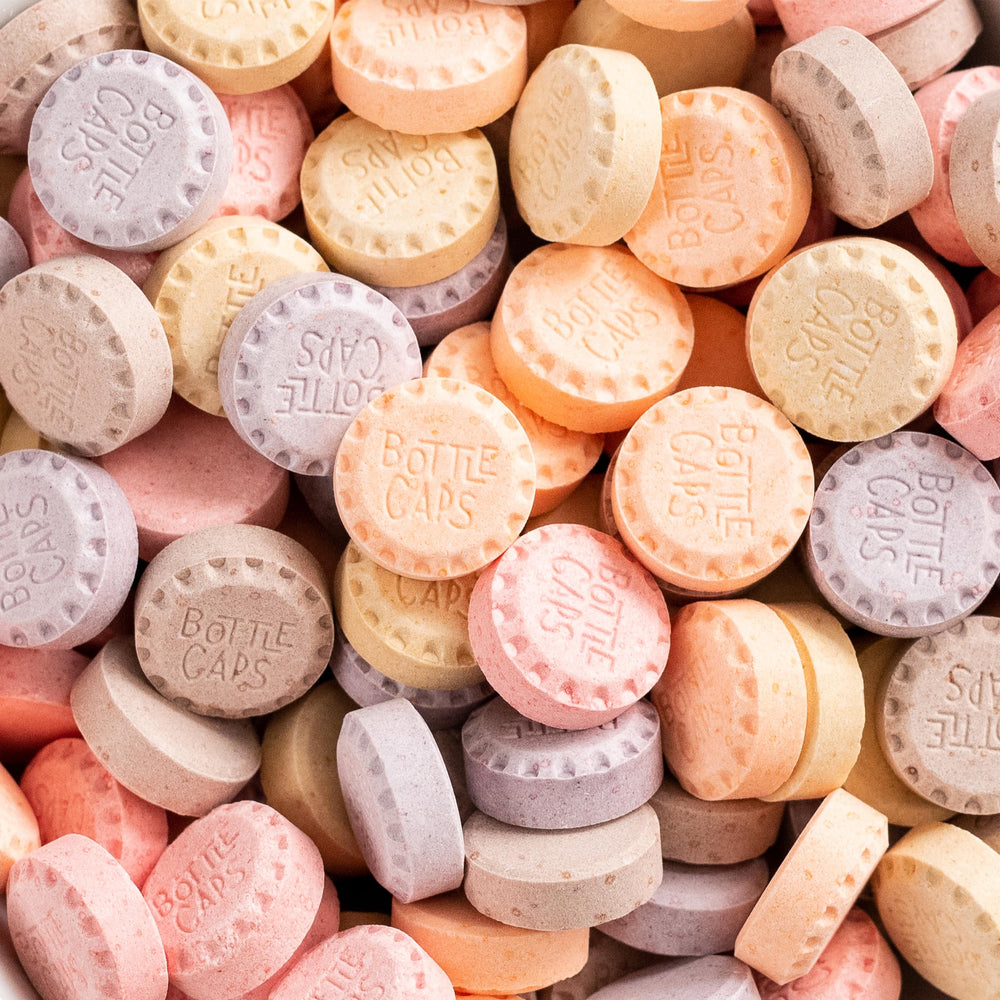 Wonka Bottle Caps on-the-go showcases convenient theater box perfect for sharing during travel.