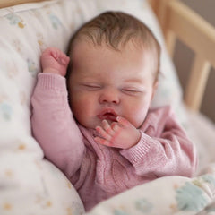 WOOROY Baby Doll with weighted cloth body and vinyl limbs for lifelike feel.