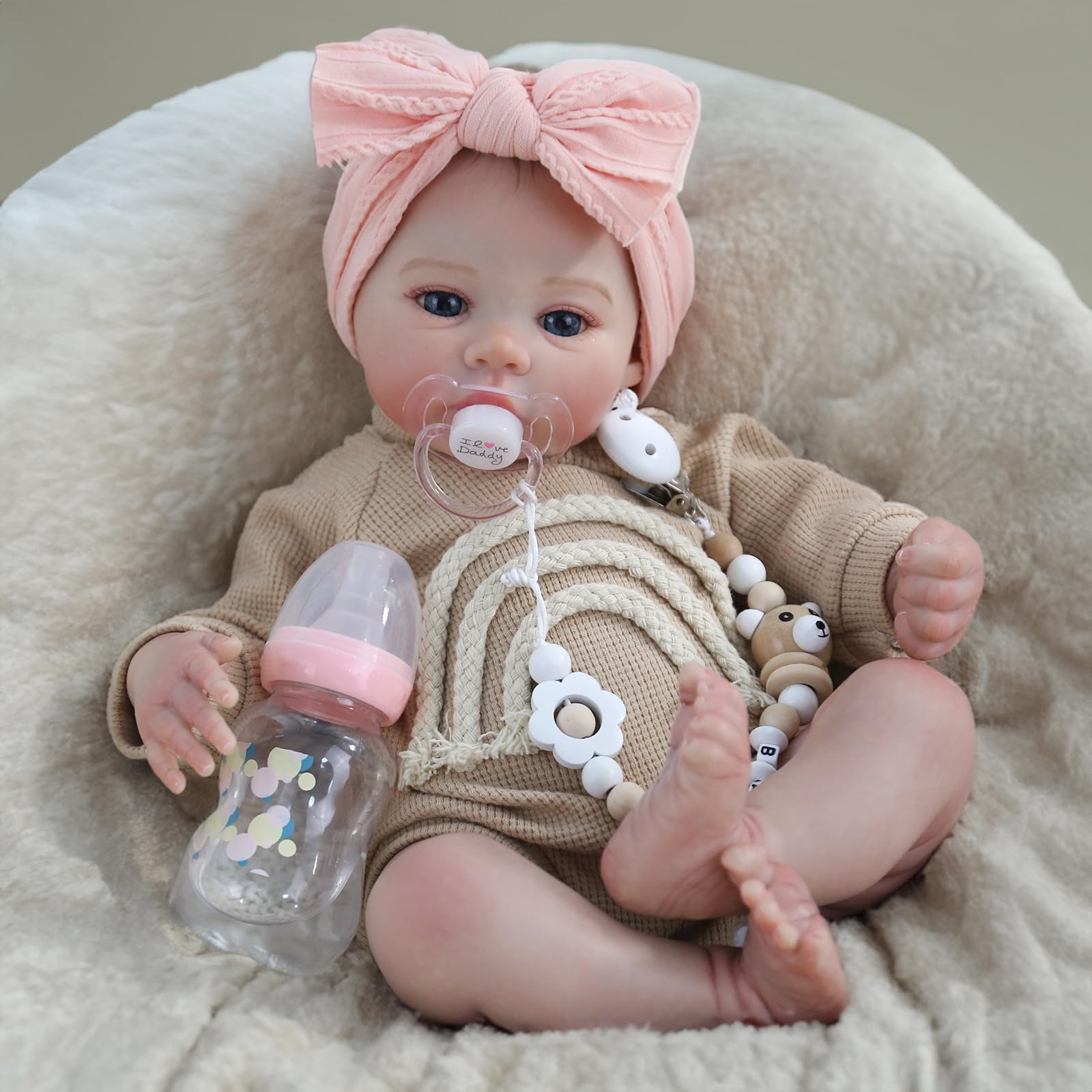 WOOROY Realistic reborn baby girl face close-up showing lifelike skin details.