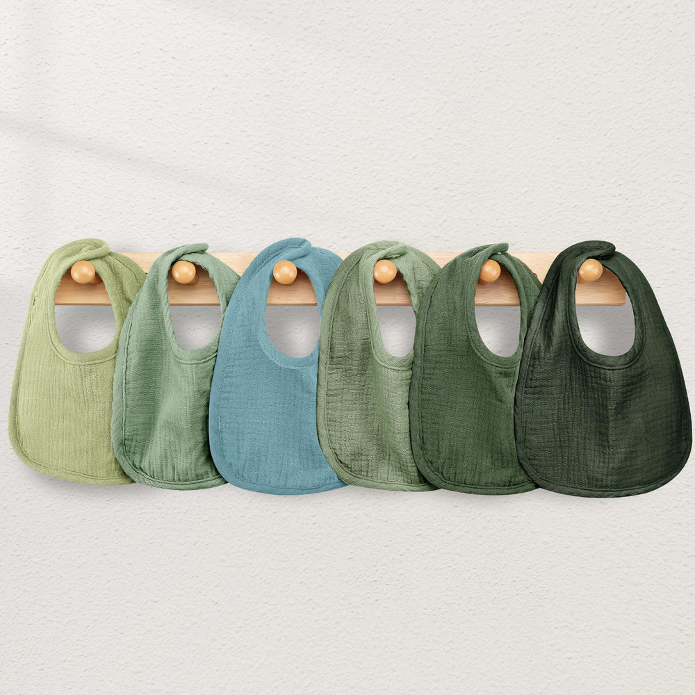 Wrrernsin bib in use for feeding, burping, and teething messes.