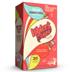 Wyler's Light Cola stick dissolving in water for bold, sugar-free flavor.