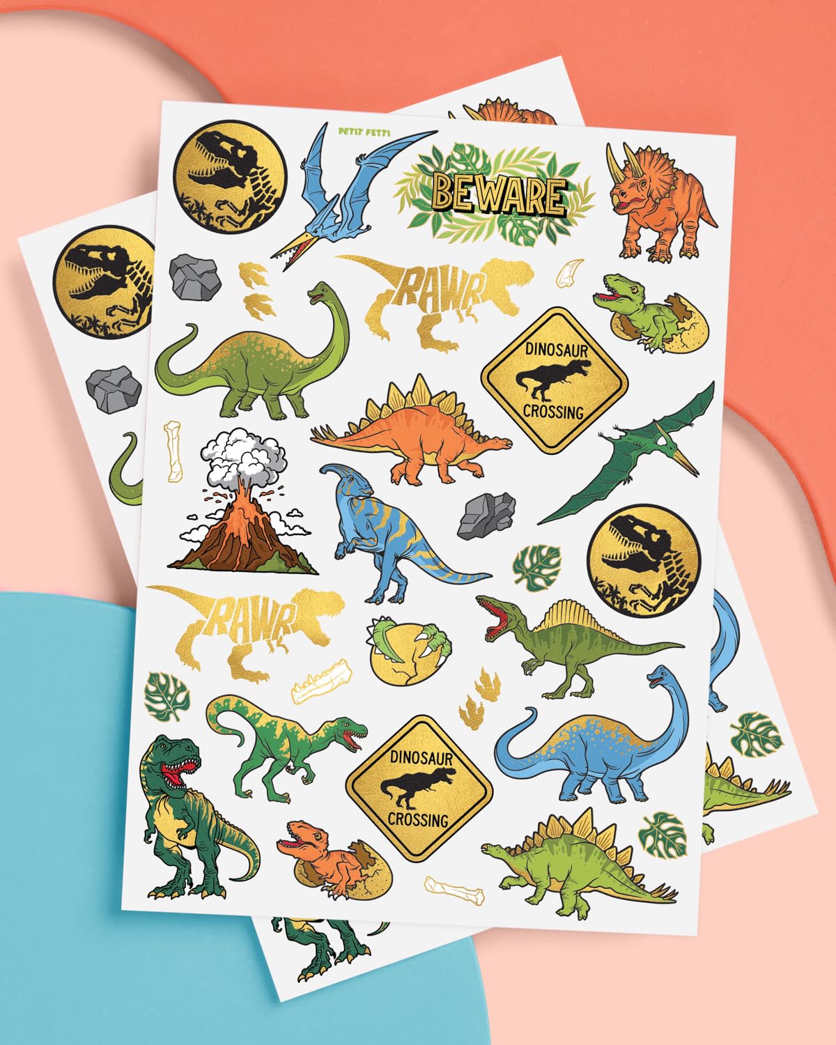xo Fetti Stegosaurus tattoo with gold accents for playful dino decoration.