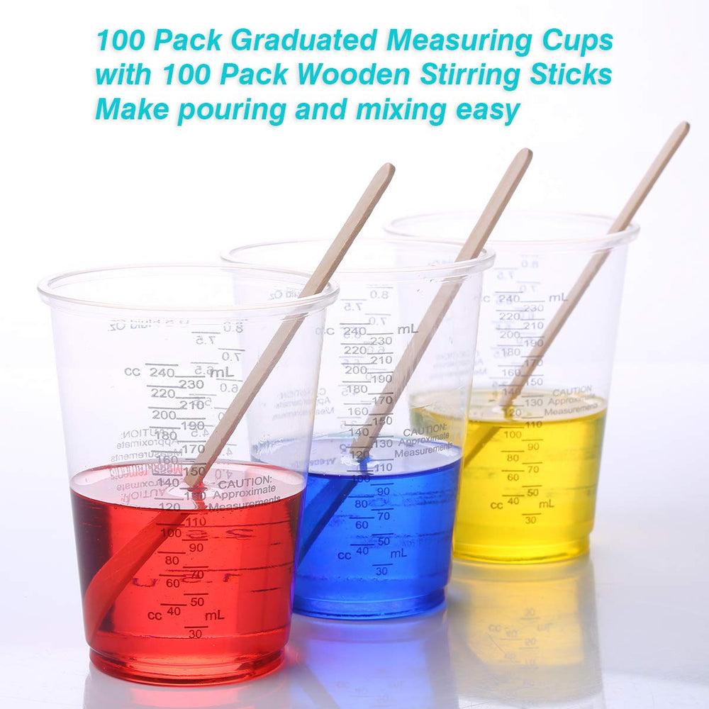 XUXU epoxy resin mixing in cups with sticks.