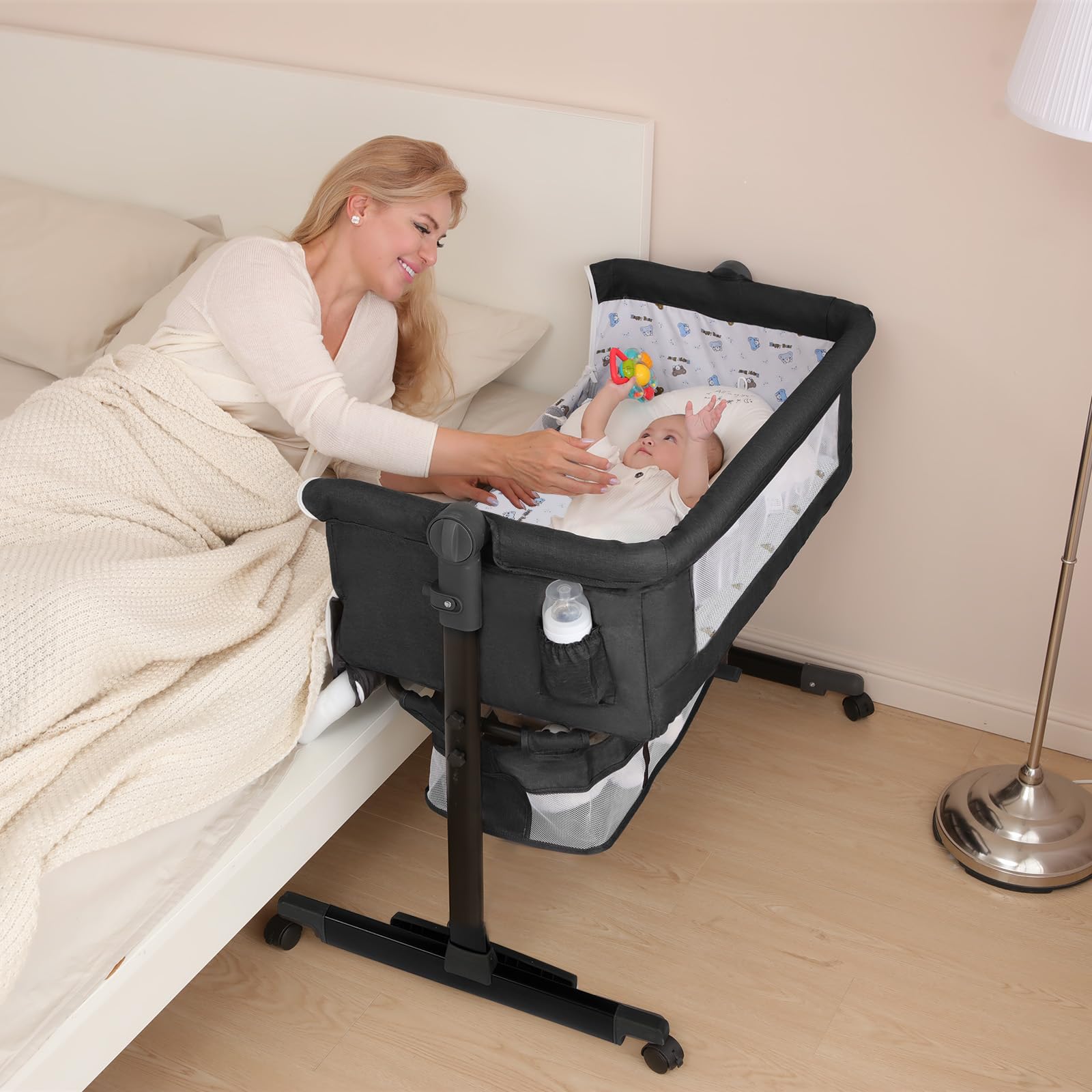 YADAQE Baby Cradle with a breathable mosquito net and waterproof layer for a dry sleeping surface.