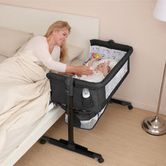 YADAQE Baby Cradle with a breathable mosquito net and waterproof layer for a dry sleeping surface.