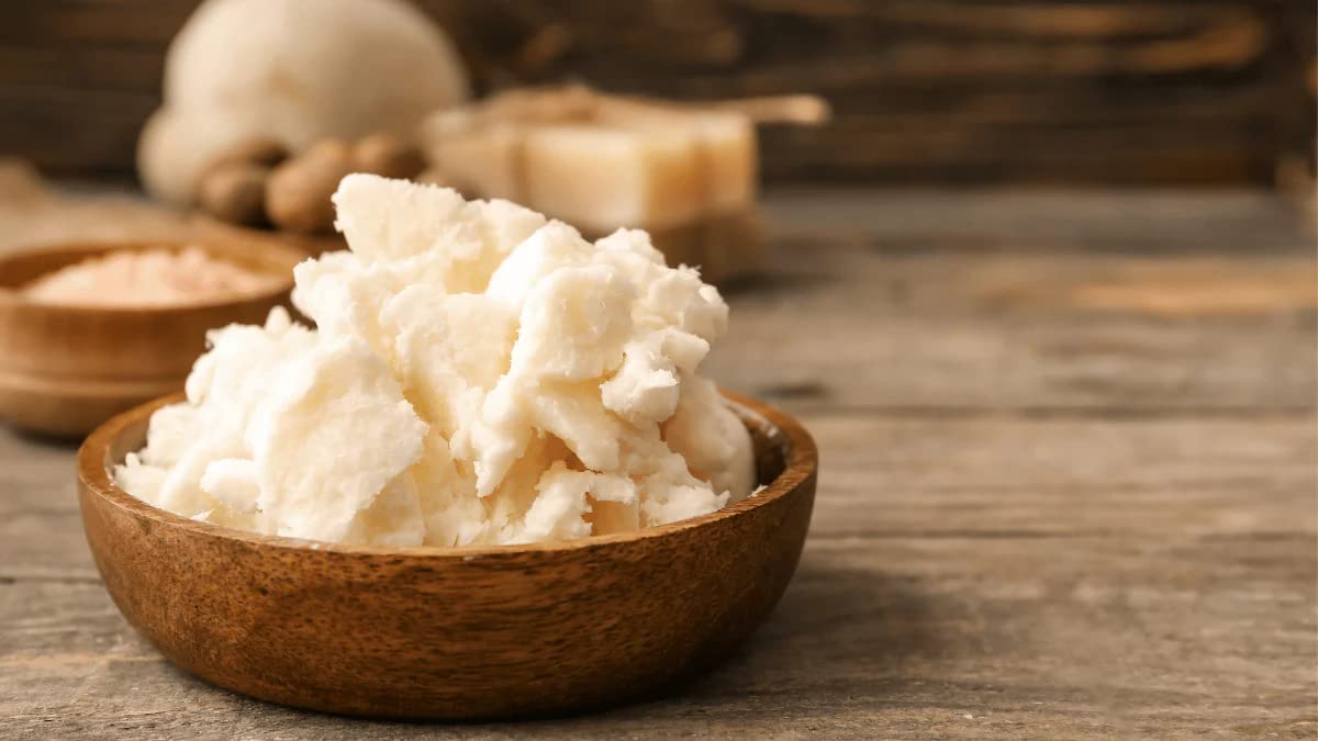 Yajna mango butter on hair ends, adding moisture and shine.