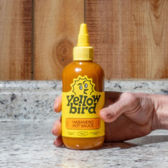 Yellowbird Classic sauce pour demonstrates medium heat, ideal for tacos and eggs.