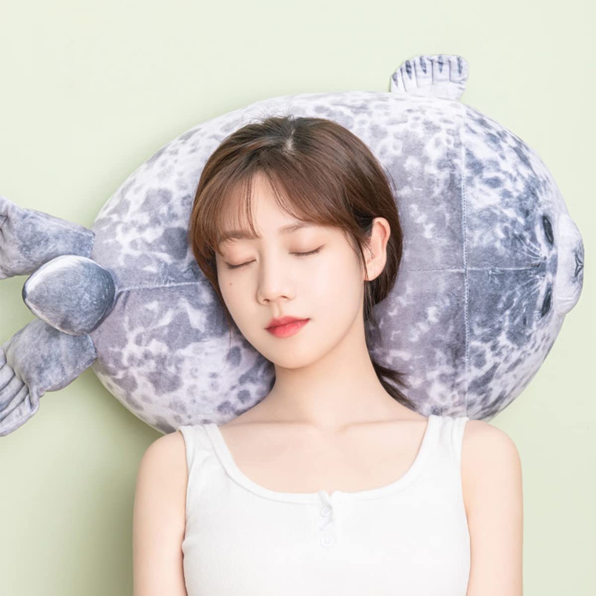 YESGIRL seal plush as decor adds cute focal point to a bedroom.