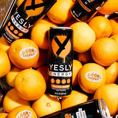 Yesly Energy Orange Cream bottle label highlighting electrolytes and vitamins