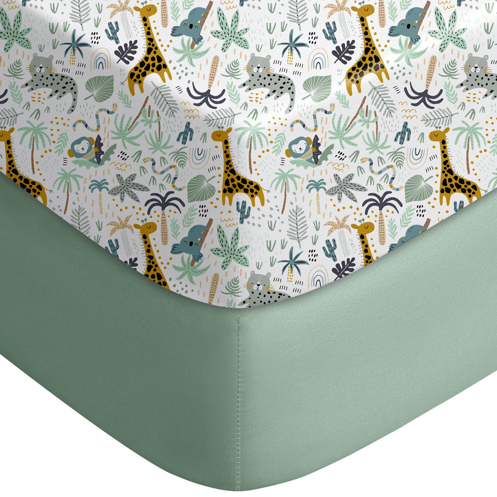 Yoofoss pack and play sheet in green giraff pattern on a playpen mattress for breathable comfort.