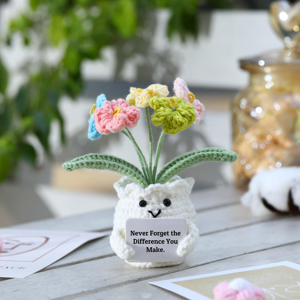 YOOJEE Forget-Me-Not crochet flower on a desk adds lasting decorative warmth.