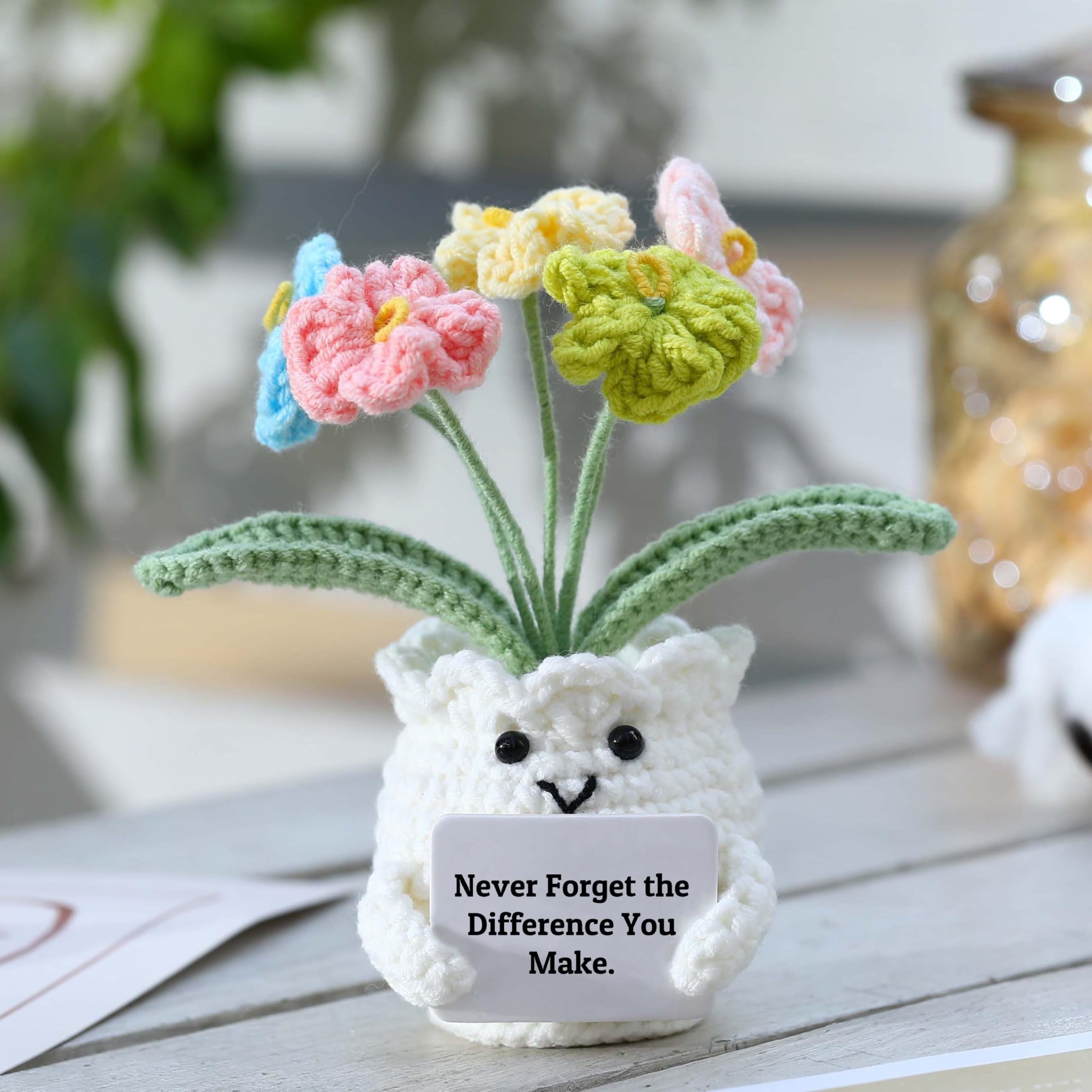 YOOJEE Forget-Me-Not crochet potted plant offers everlasting decor beyond real blooms.