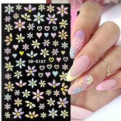 YOSOMMK 3D embossed daisy decals adding texture to nails.