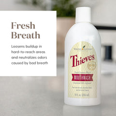 Thieves Fresh Essence mouthwash in a glass demonstrates refreshing, non-irritating rinse.