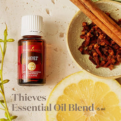 Young Living Thieves diffuser-ready blend releasing warm, comforting fragrance for home or office.