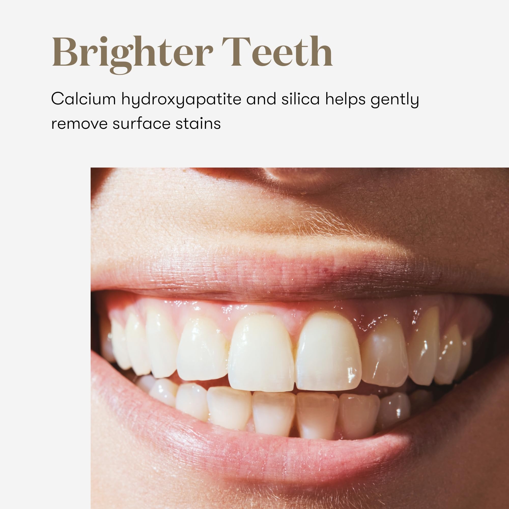 Brushing with Young Living Thieves Whitening Toothpaste for a refreshing mint experience.