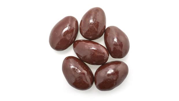 Detail of 60% dark chocolate coating on Yupik almonds, indulgent