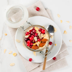 Almonds spilled from bag into a rustic bowl for baking