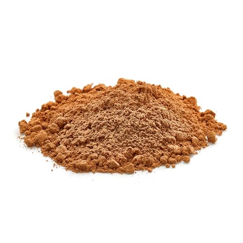 Yupik cocoa powder being sifted into batter for brownies.