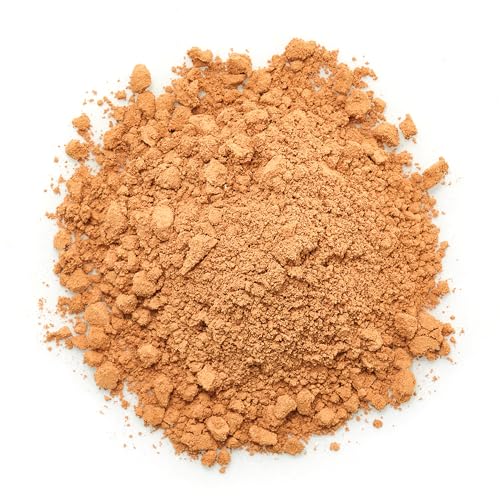 Yupik cocoa powder texture close-up showcasing rich color for beverages.