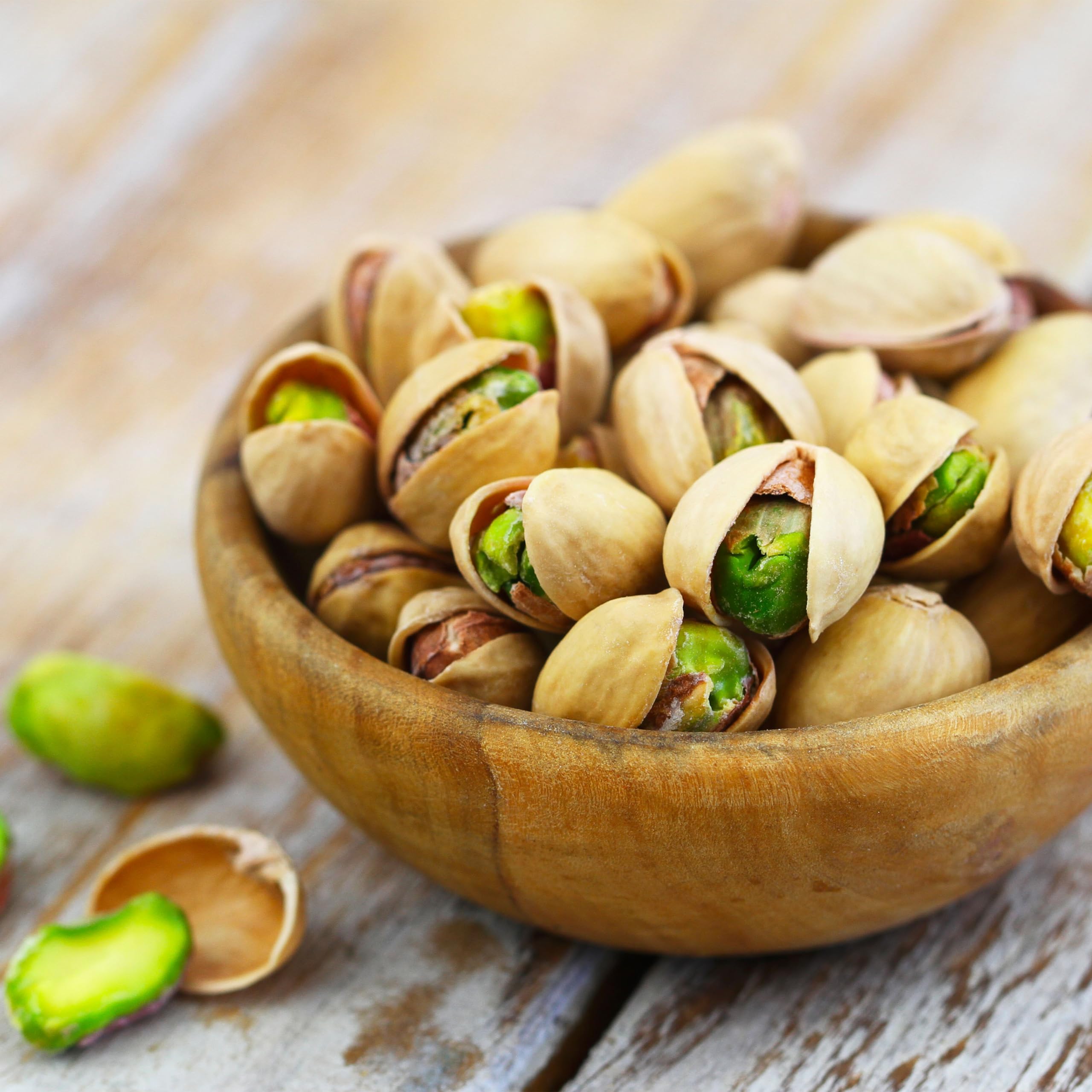 Yupik dry roasted pistachios in-shell being cracked invites mindful nibbling.