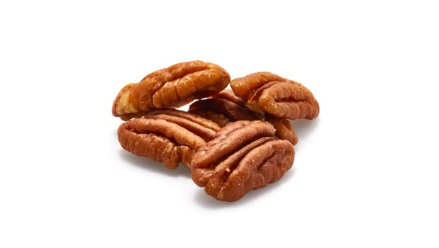 Yupik shelled halved pecans in a bowl ready to mix into recipes