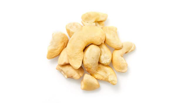 Close-up of Yupik cashews butts showing thick ends and buttery texture.