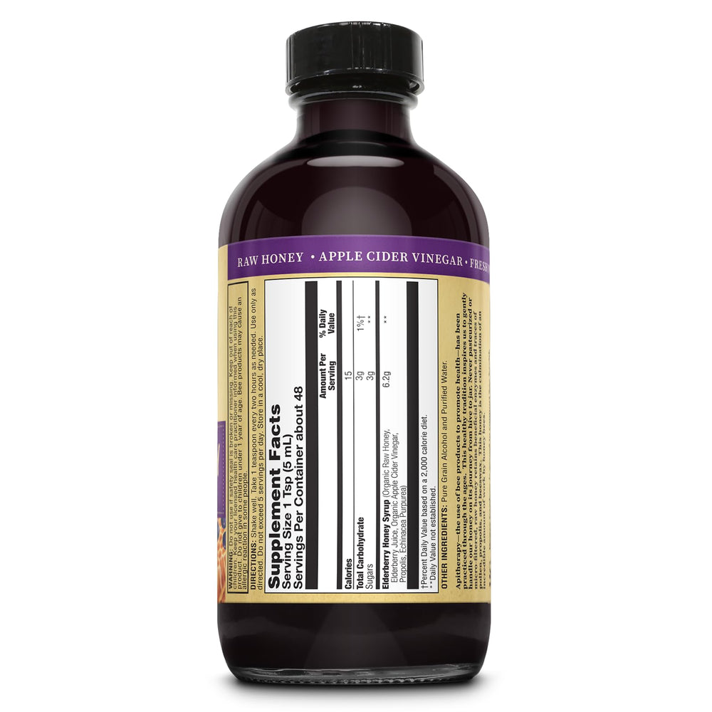 ZAND Elderberry and Honey Immune Syrup being poured for everyday use.