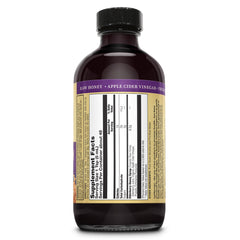 ZAND Elderberry and Honey Immune Syrup being poured for everyday use.