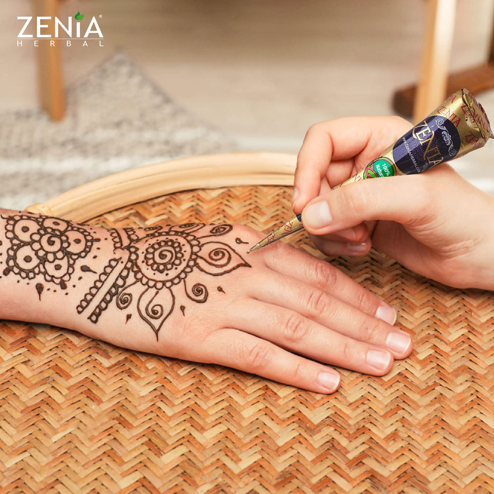 Zenia freckles design with reddish-brown paste on skin