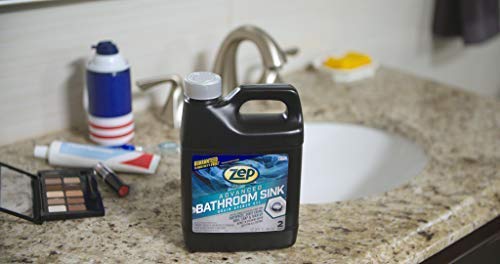 Clear bottle sits beside sink, ideal for quick bathroom drain cleanup.