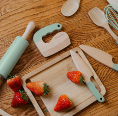 ZICOTO cutting board and wooden chopper for kid-safe prep sessions.