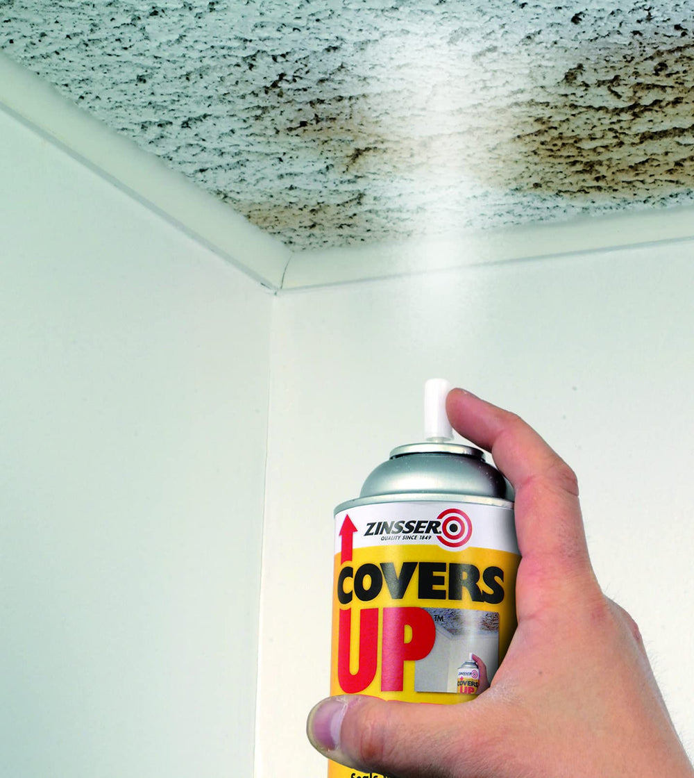 Zinsser Covers Up vertical spray ceiling paint showing stain coverage on ceilings