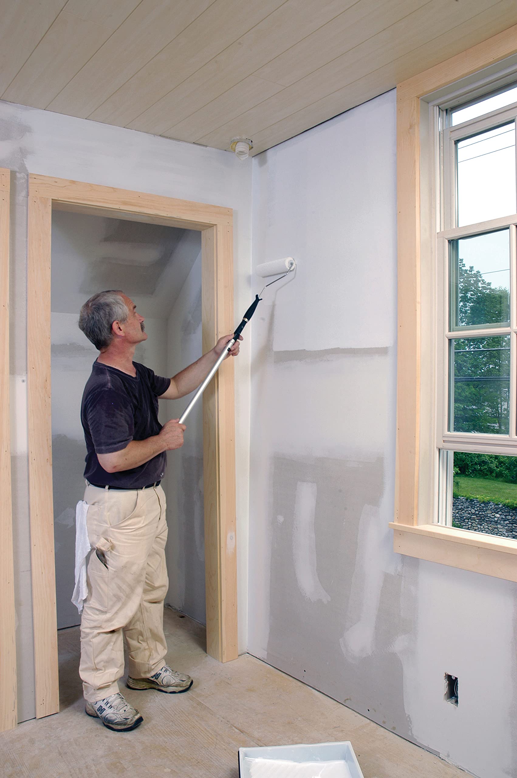 Zinsser Perma-White roller application demonstrating easy, self-priming coverage without sanding.