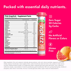 Zipfizz pink grapefruit powder poured into water for hydration.
